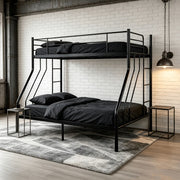 Single-over-double black metal bunk bed in a modern industrial bedroom