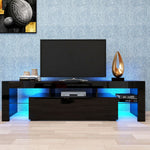 Black TV console with blue LED lighting beneath a wall-mounted television
