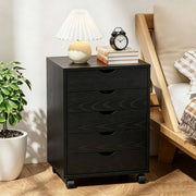 Black Bedside Table with Drawers (5-Tier) next to a lamp and clock, providing stylish storage solutions.
