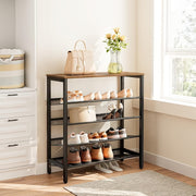 Industrial shoe rack beside a window with shoes on mesh shelves and a handbag and flowers on top