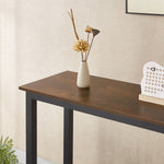Console Table showcasing a rustic design with a vase of dried flowers on top.