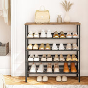 Front view of an industrial shoe rack storing trainers, heels and ankle boots beneath a rustic wood look top