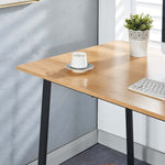 Minimalist home office computer desk with light wood finish