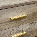 Close-up of modern drawer handles on a wood-grain surface, complementing the Modern LED Pedestal design.