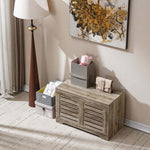 Rustic Storage Trunk Shoe Bench displayed in an entryway with decorative storage boxes and a stylish lamp.