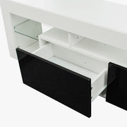 Modern Floating LED TV Stand with sleek design and open shelves, showcasing drawers in high-gloss black and white finish.