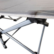 Close-up of reinforced X-frame structure on heavy-duty folding camping cot