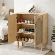 Arched Rattan Shoe Cabinet with 2 doors displaying organized shoes in a stylish entryway setting.