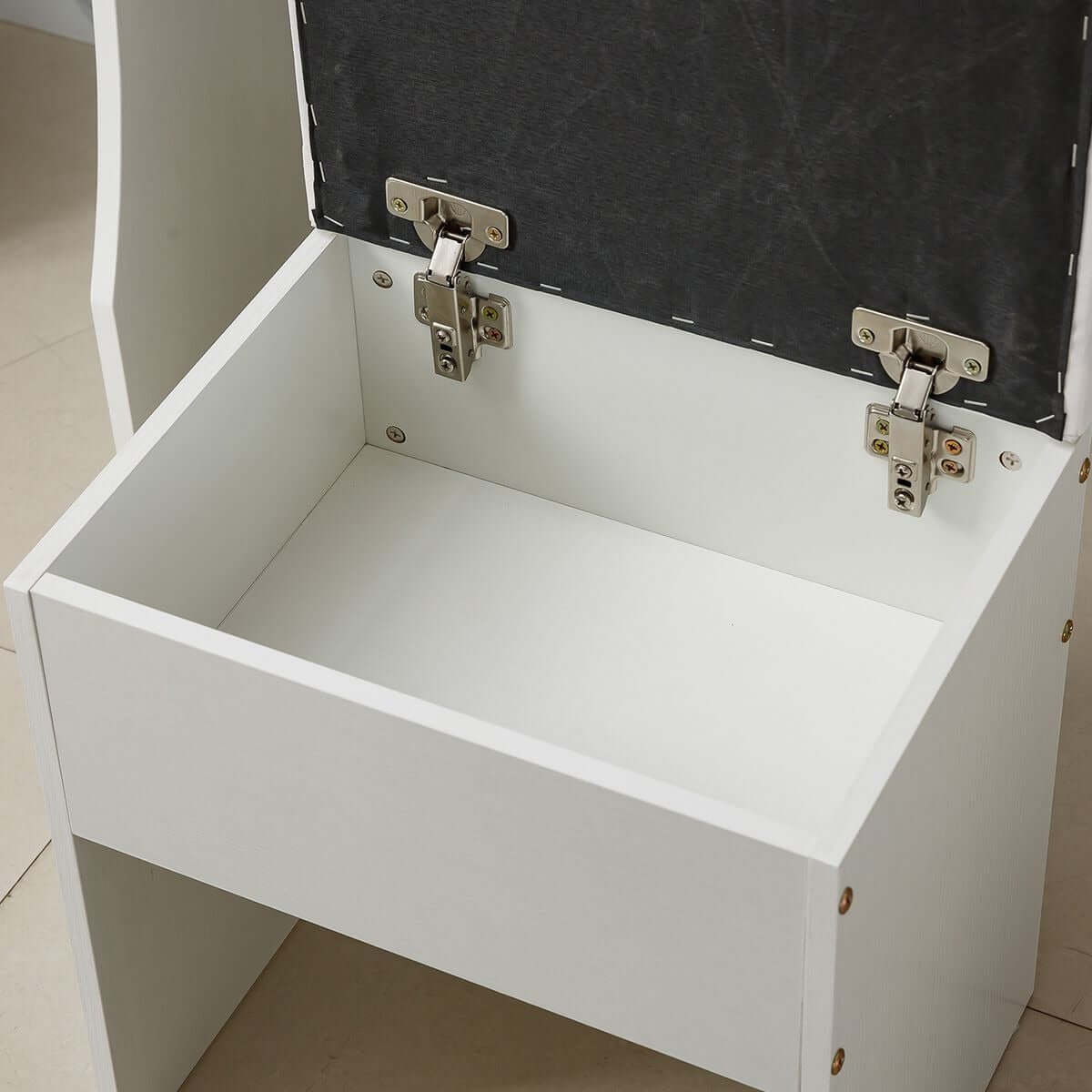 Interior view of a white dressing table with mirror showing storage space underneath.