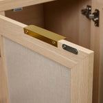 Close-up of the gold handle on the Boho 3-Door Shoe Cabinet, showcasing its rustic charm and elegant design.