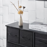 Fabric 8-Drawer Dresser with wood top featuring decorative vase and books, ideal for stylish storage.