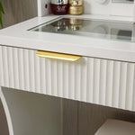 Close-up of the LED Dressing Table with Mirror featuring a gold handle and glass top.
