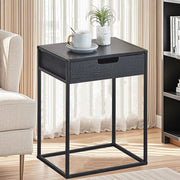 compact bedside table with drawer beside a modern bed for bedroom storage