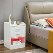 Modern LED Pedestal with open shelf and drawers beside a bed in a stylish bedroom.