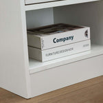 Modern LED Pedestal showcasing an open shelf with design books.
