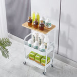 3-Tier Rolling Storage Cart with Wood Top displaying drinks and snacks on a modern white trolley.