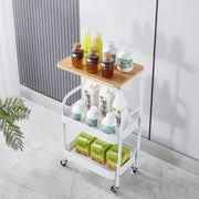 3-Tier Rolling Storage Cart with Wood Top displaying drinks and snacks on a modern white trolley.