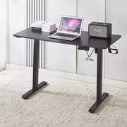 Electric Standing Desk Black Adjustable 120cm with laptop and speaker on top, ideal for ergonomic workspaces.