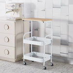 3-Tier Rolling Storage Cart with Wood Top placed next to a coffee machine and a beige dresser.
