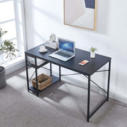 Black study desk with laptop, side shelves and storage basket beside a bright window