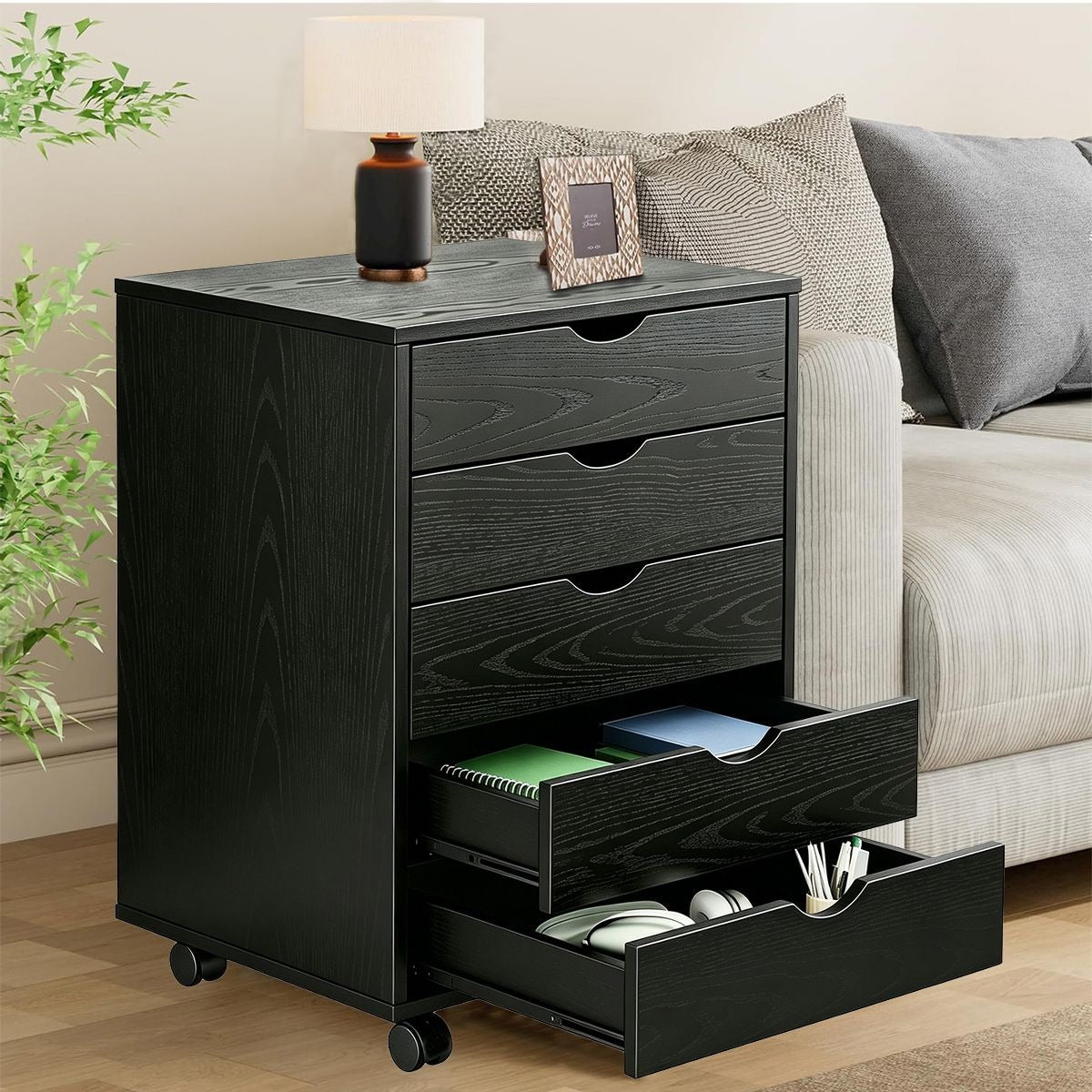 Black Bedside Table with Drawers featuring four spacious drawers and a stylish lamp on top, perfect for bedroom organization.