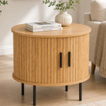 Minimalist bedside nightstand with sliding doors styled in modern living room