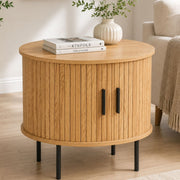Minimalist bedside nightstand with sliding doors styled in modern living room
