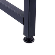 Close-up of adjustable foot and black metal frame on the 120cm office desk