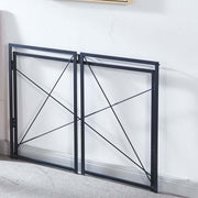 Folding black metal desk frames stored flat for compact storage