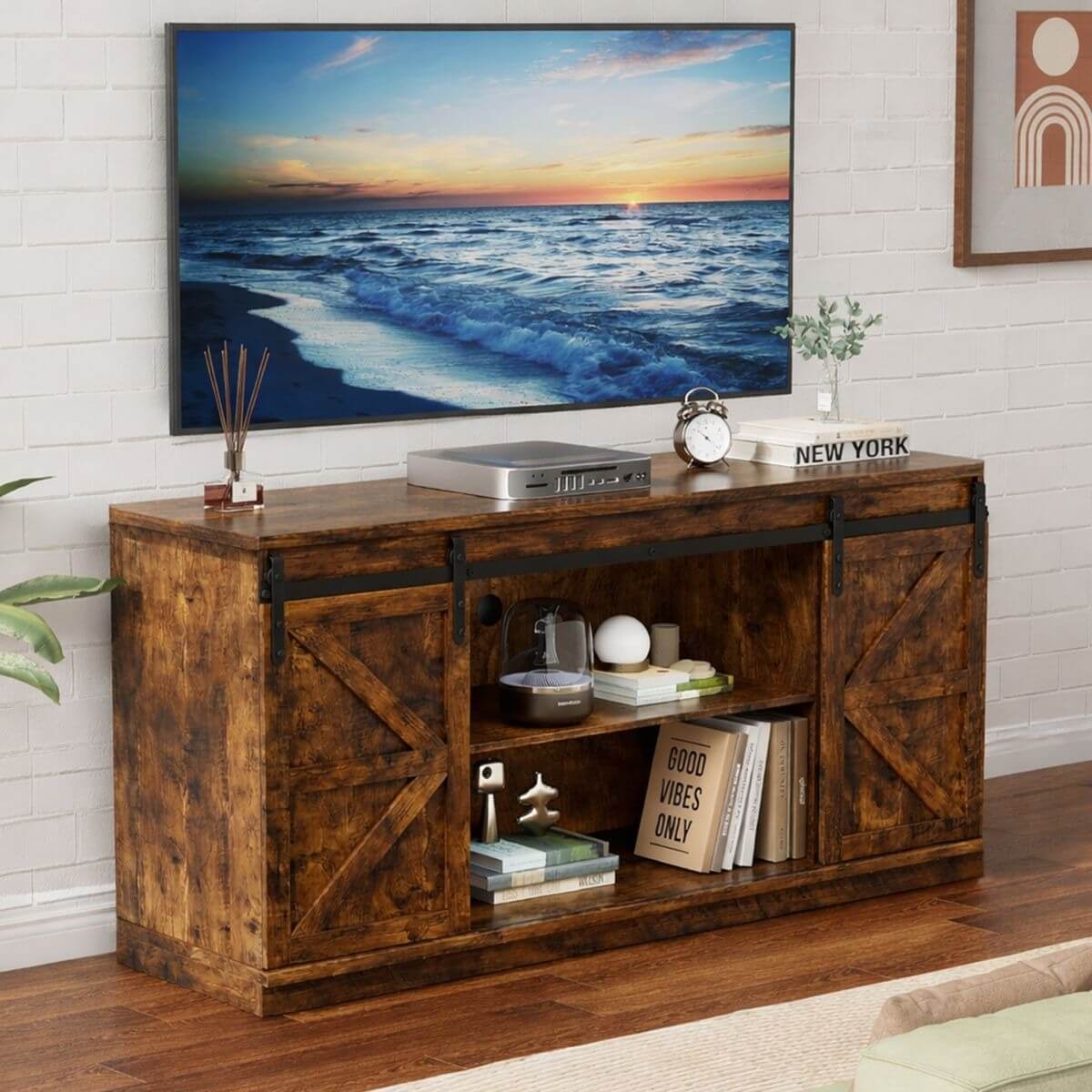 Farmhouse Sliding TV Stand displayed with a scenic ocean view painting above it, showcasing rustic charm and modern functionality.