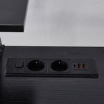 Close-up of black built-in AC power outlets and USB ports