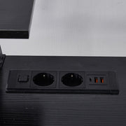 Close-up of black built-in AC power outlets and USB ports