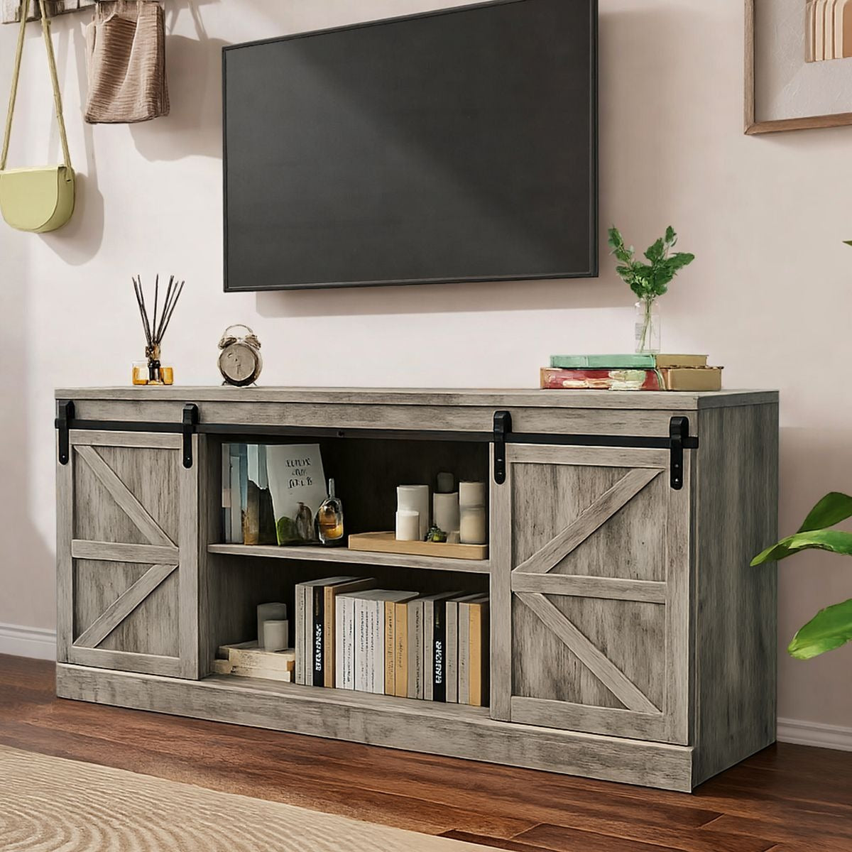 Farmhouse Sliding TV Stand in a stylish living room setting with a television mounted above it.