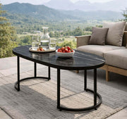 Oval Black Marble Coffee Table with drinks and snacks on a patio overlooking mountains