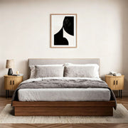 Round side table with storage used as a bedside nightstand with lamp