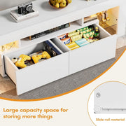 Open white TV stand drawers displaying games, controllers and media accessories