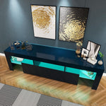 Black LED media console with turquoise lighting in a contemporary room