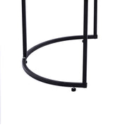 Detail of the base of an Oval Black Marble Coffee Table showcasing its stylish black metal frame.