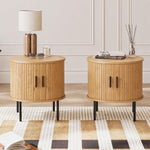 Two round side tables with storage used as bedroom nightstands