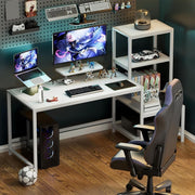 White gaming computer desk setup with dual monitors and ergonomic chair
