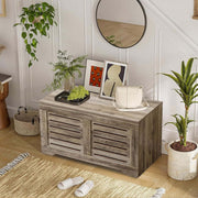 Rustic Storage Trunk Shoe Bench in a bright entryway with plants and decor.