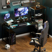 Black gaming computer desk setup with dual monitors and storage