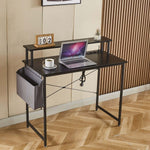 Modern computer desk with power outlets, laptop, coffee cup, and side storage for home office.