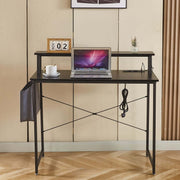 Modern computer desk featuring power outlets, sleek design, and workspace setup with a laptop and coffee.