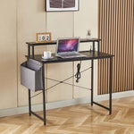 Modern computer desk with power outlets, laptop, and storage for an organized workspace.