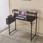 Modern computer desk with power outlets, stylish design featuring laptop and accessories in a home office setting.