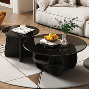 Modern Glass Nesting Coffee Table set in a stylish living room with sleek black finish and decorative items.