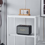 White computer desk shelving unit displaying smart speaker and decor