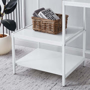 Close-up of white multi-tier storage shelves for computer desk organization