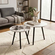 Marble effect nesting coffee table set in modern living room with grey sofa
